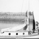 Norma and Jody Hand giving advice to Tom Hand aboard gaff-rig sailboat, prior to departing Port Chicago for Berkeley.